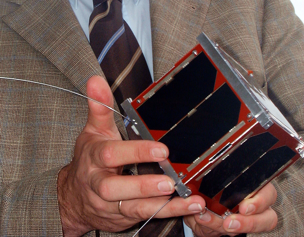 Klaus Schilling with the German first pico-satellite (a satellite with 1 kg of mass), designed and realized by his team 2005. Image credit - University Würzburg
